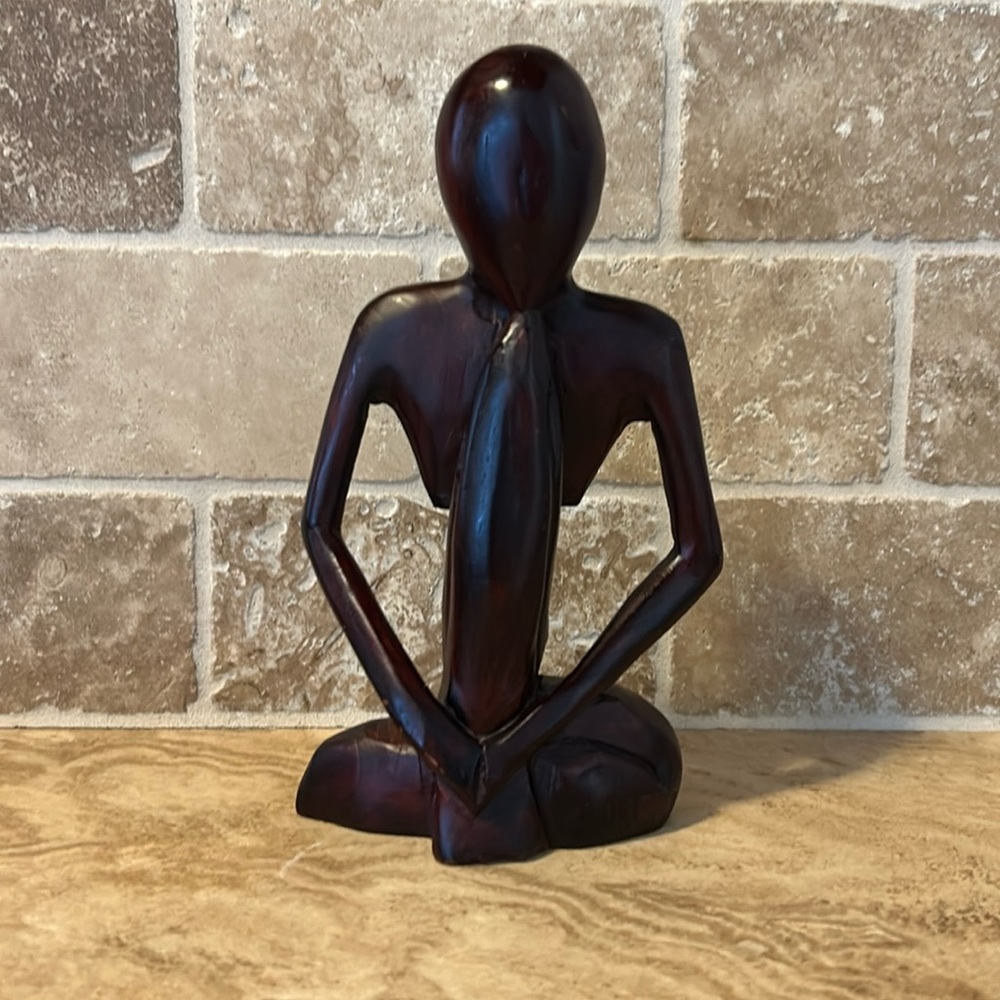 Wooden meditation statue